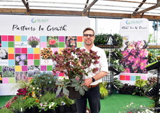Marc Radsma of Skagit holding the hellebore Ice ‘N Roses Red of German breeding Heuger. They have added over 300 varieties.